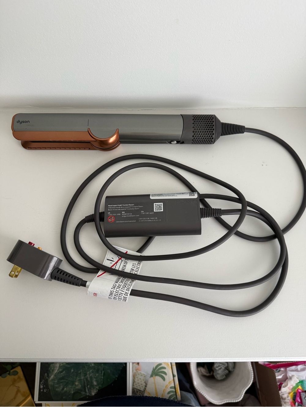 Dyson hair straightener in gray and copper accents